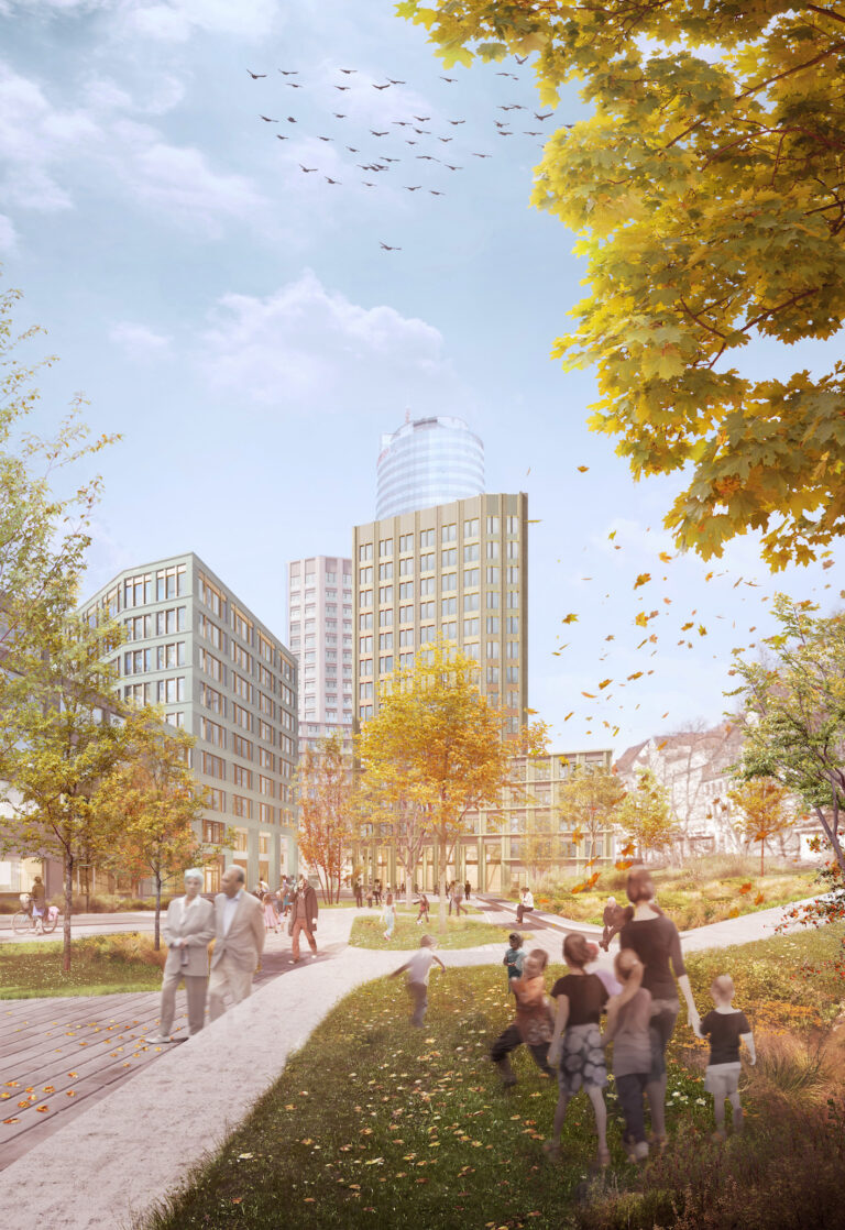 Vertikale Ansicht der drei neuen Hochpunkte am Eichplatz, umgeben von herbstlichen Bäumen und spazierenden Passanten.